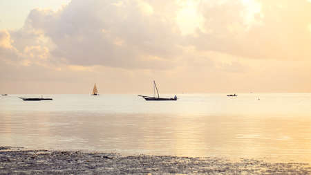 Boats in the ocean bay on a sunny afternoon. Fishing boats in thの写真素材