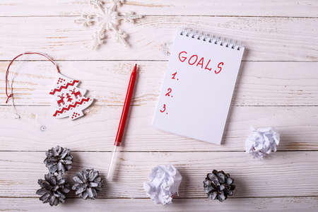 Workplace with a diary, decorations and gifts.