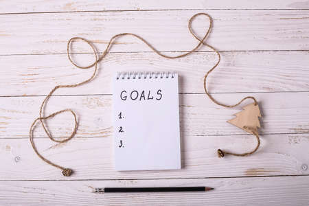 Workplace with a diary, decorations and gifts. New Years list oの写真素材