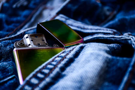 Denim clothes lying on the table with the glasses. Blue jeans wiの写真素材