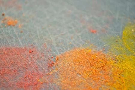 Eastern condiments scattered on a table at home. Turmeric and peの写真素材