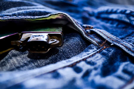 Denim clothes lying on the table with the glasses. Blue jeans wiの写真素材