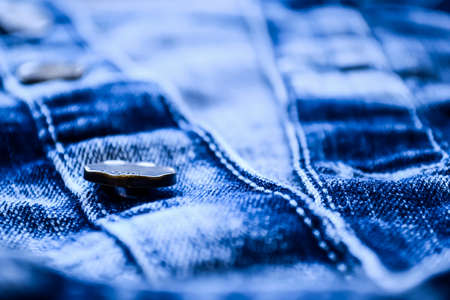 Denim clothes lying on the table with the glasses. Blue jeans wiの写真素材
