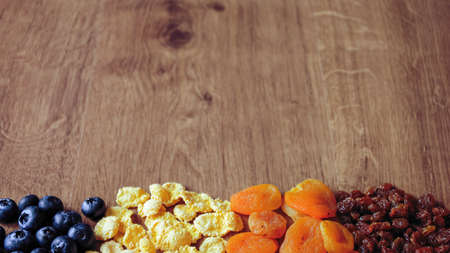 Cereal and fruit for Breakfast on the table. Delicious food at hの写真素材