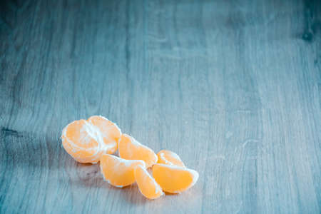 A composition of fresh mandarins on the table in the afternoon.の写真素材