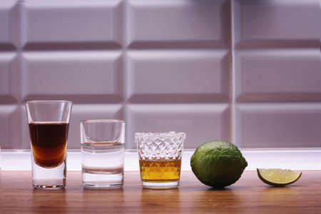 Alcoholic strong drinks in glass on the backgroundの写真素材
