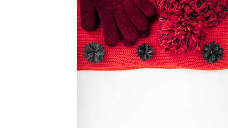 Knitted scarf and hat on the table.の写真素材