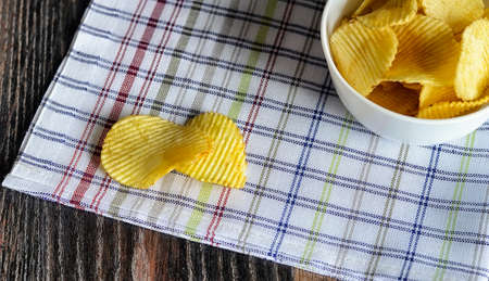 Salty snacks for beer on woodenの写真素材