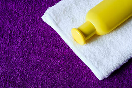 Toiletries and towels lying on the table. Soap and cream for wasの写真素材