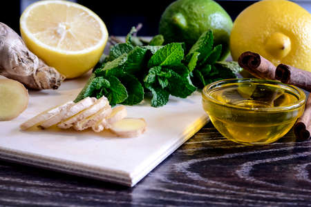 Drink from the lemon on the table. Lemon and ginger drink. The wの写真素材