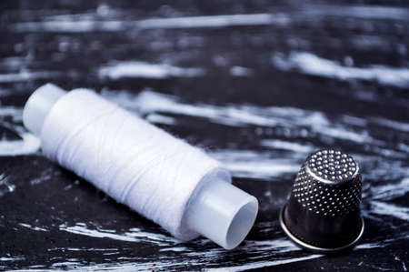 The spool of thread on the table. Thread on a reel for craft. Maの写真素材