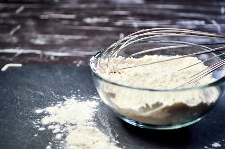 Flour and whisk for cooking food and cooking for women. Womens