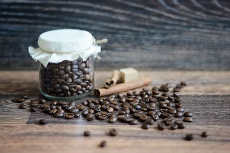 Coffee beans on a wooden tableの写真素材
