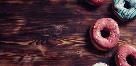 Sweet donuts on a dessert and a cup of tea