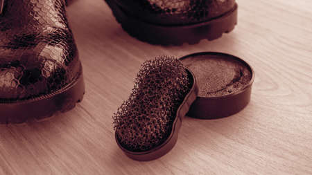 Shoes and scouring cream on the floor. Clean shoes for walking.
