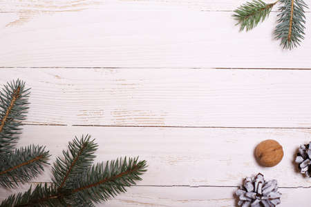 Decorations and Christmas tree on a white wooden background