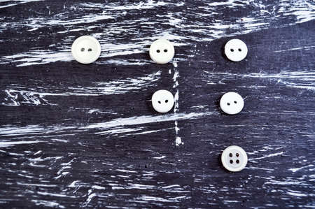 Buttons for clothing and sewing on the table. Decorative items o
