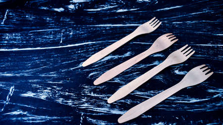 Silver fork lying on a wooden table. Cutlery for eating. Device