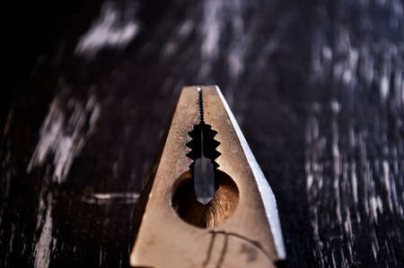 Pliers for repair work lying on the table. Repair tools in the h