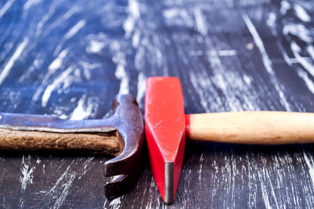 Hammer to repair lying on a wooden table. Mens housework. Workiの写真素材