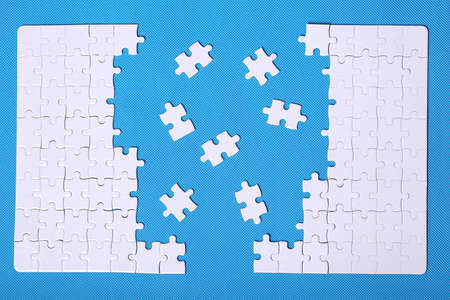 White details of a puzzle on a blue background.