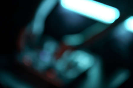 DJ mixer disco illuminated by floodlights at the clubの写真素材