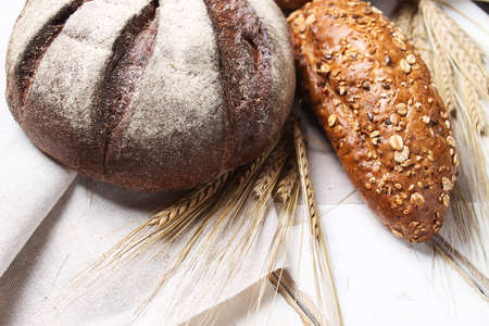Fresh baked bread with ears on the tableの写真素材