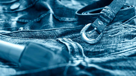 Denim clothes lying on the table with the glasses. Blue jeans wiの写真素材