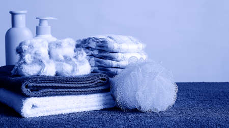 Toiletries and towels lying on the table. Soap and cream for wasの写真素材