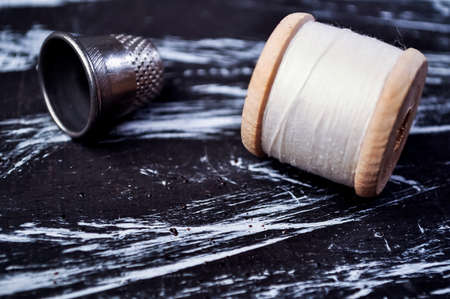 The spool of thread on the table. Thread on a reel for craft. Maの写真素材