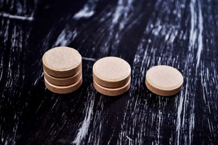 Pills and vitamins for health on the table. Medications to treat