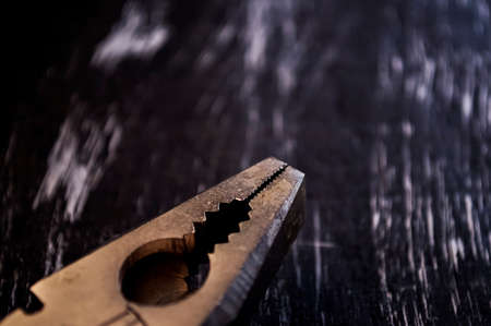 Pliers for repair work lying on the table. Repair tools in the h