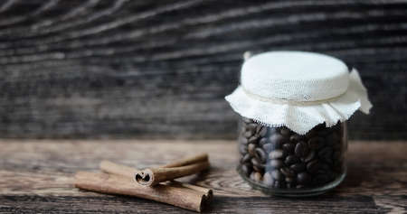 Coffee beans on a wooden backgroundの写真素材
