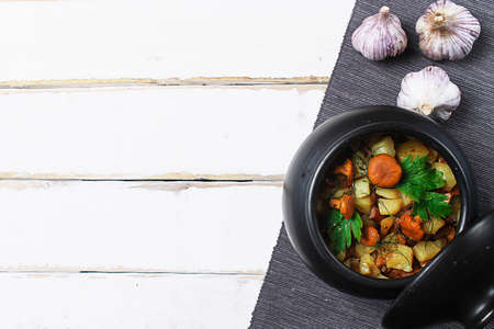 potatoes with mushrooms in a clay pot. Mushrooms from the forestの写真素材