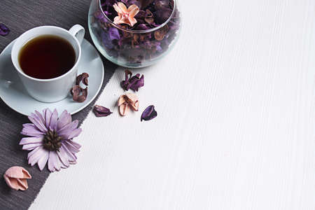 tea with flowers on the table. A quick snack. In a good mood. Fl