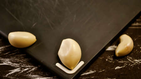 A composition of cloves of garlic on the table. Healthy eating.の写真素材