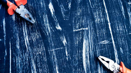 Pliers for repair work lying on the table. Repair toolsの写真素材