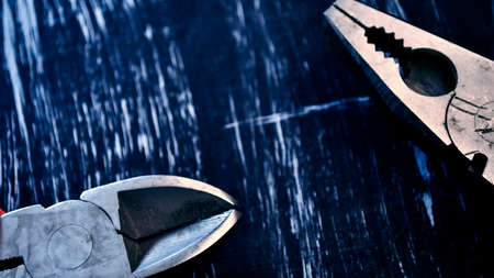 Pliers for repair work lying on the table. Repair toolsの写真素材