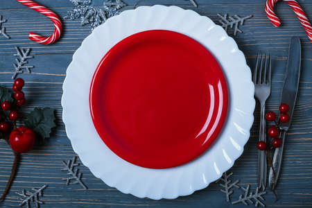 Plates and dishes for the Christmas table. Festive table settingの写真素材