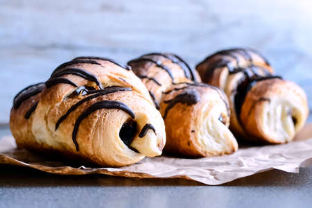 Fresh croissants with chocolate on the table. Delicious Breakfasの写真素材