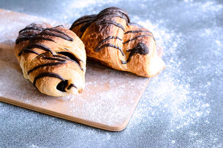 Fresh croissants with chocolate on the table. Delicious Breakfasの写真素材