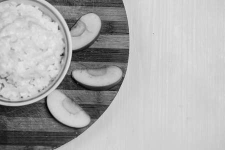 Porridge with fruit on the tableの写真素材