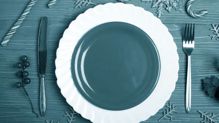 Plates and dishes for the Christmas table. Festive table settingの写真素材