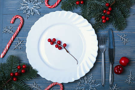 Plates and dishes for the Christmas table. Festive table settingの写真素材