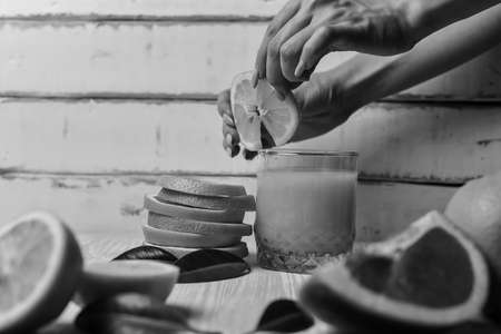 orange lying on a wooden tableの写真素材