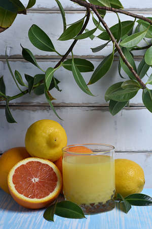 Fruit and juice on the tableの写真素材