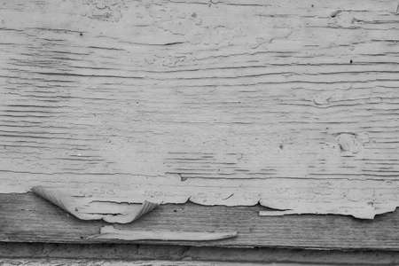 old paint on a dry wooden wallの写真素材