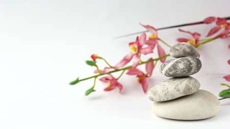 Balance of stones. Stones for spa treatments on a white backgrouの写真素材