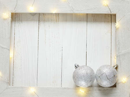 Christmas bright garlands on a wooden light backgroundの写真素材