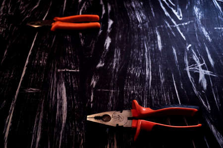 Pliers for repair work lying on the table. Repair toolsの写真素材